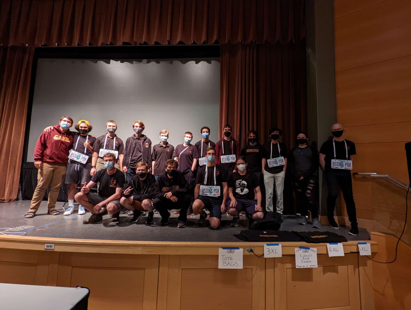OSUSEC members pose on stage after their first-place win being announced.